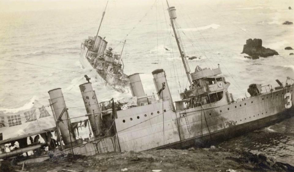 Sailor dangles from rescue line in front of USS S.P. Lee in foreground and the USS Nicholas in background after seven United States Navy destroyers ran aground at Honda Point north of Point Conception in heavy fog Sept. 8, 1923. It was the worst peacetime Navy disaster with the death of 23 seamen and the loss of the destroyers.