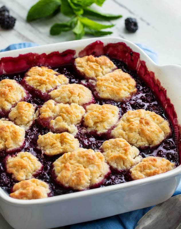 <p>The Chunky Chef</p><p>Blackberry cobbler is the perfect recipe for any hot summer day. Perfectly sweet and tart, with a golden biscuit topping, it’s the ultimate easy dessert.</p><p><strong>Get the recipe: <a href="https://www.thechunkychef.com/blackberry-cobbler/" rel="nofollow noopener" target="_blank" data-ylk="slk:Blackberry Cobbler;elm:context_link;itc:0;sec:content-canvas" class="link ">Blackberry Cobbler</a></strong></p>