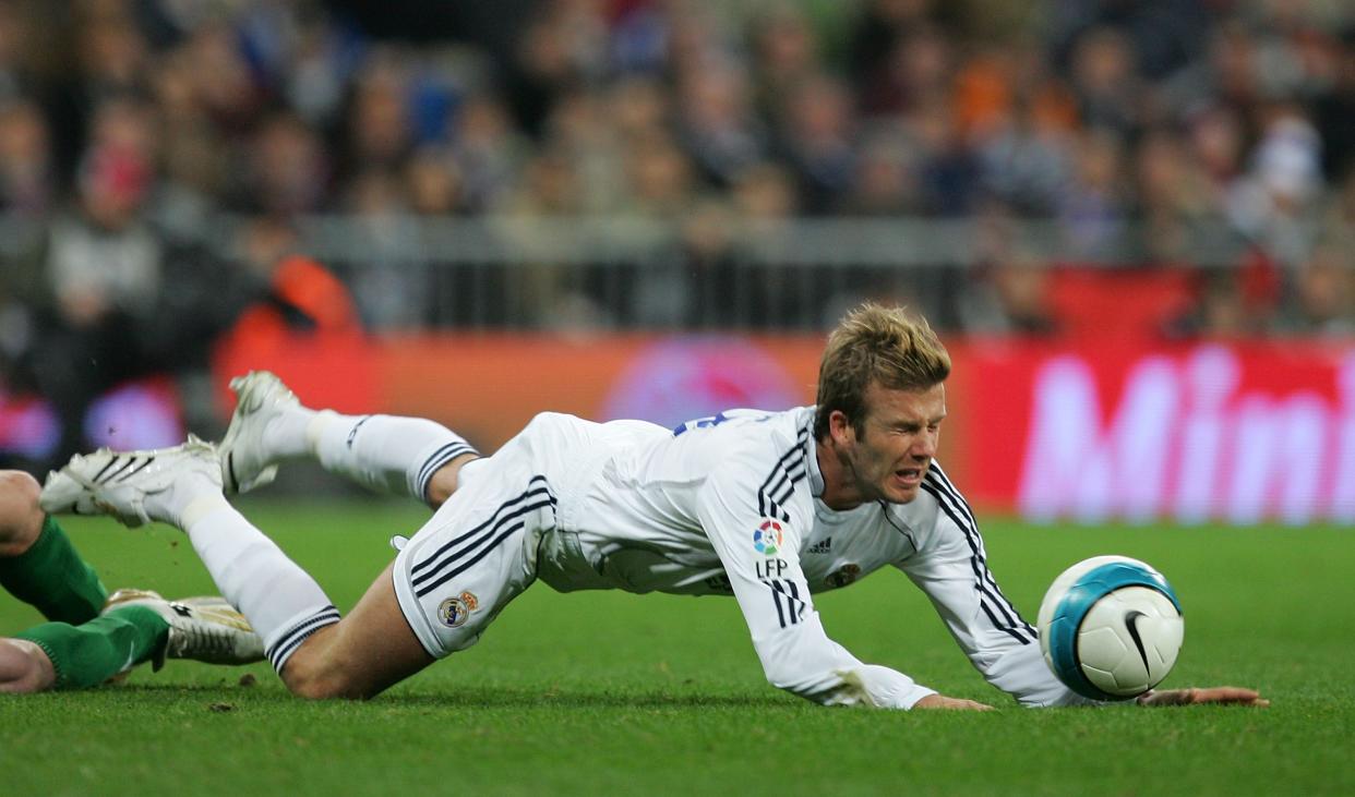 David Beckham of Real Madrid takes a fall during the Primera Liga match between Real Madrid and Real Betis at the Santiago Bernabeu stadium on February 17, 2007 in Madrid, Spain.