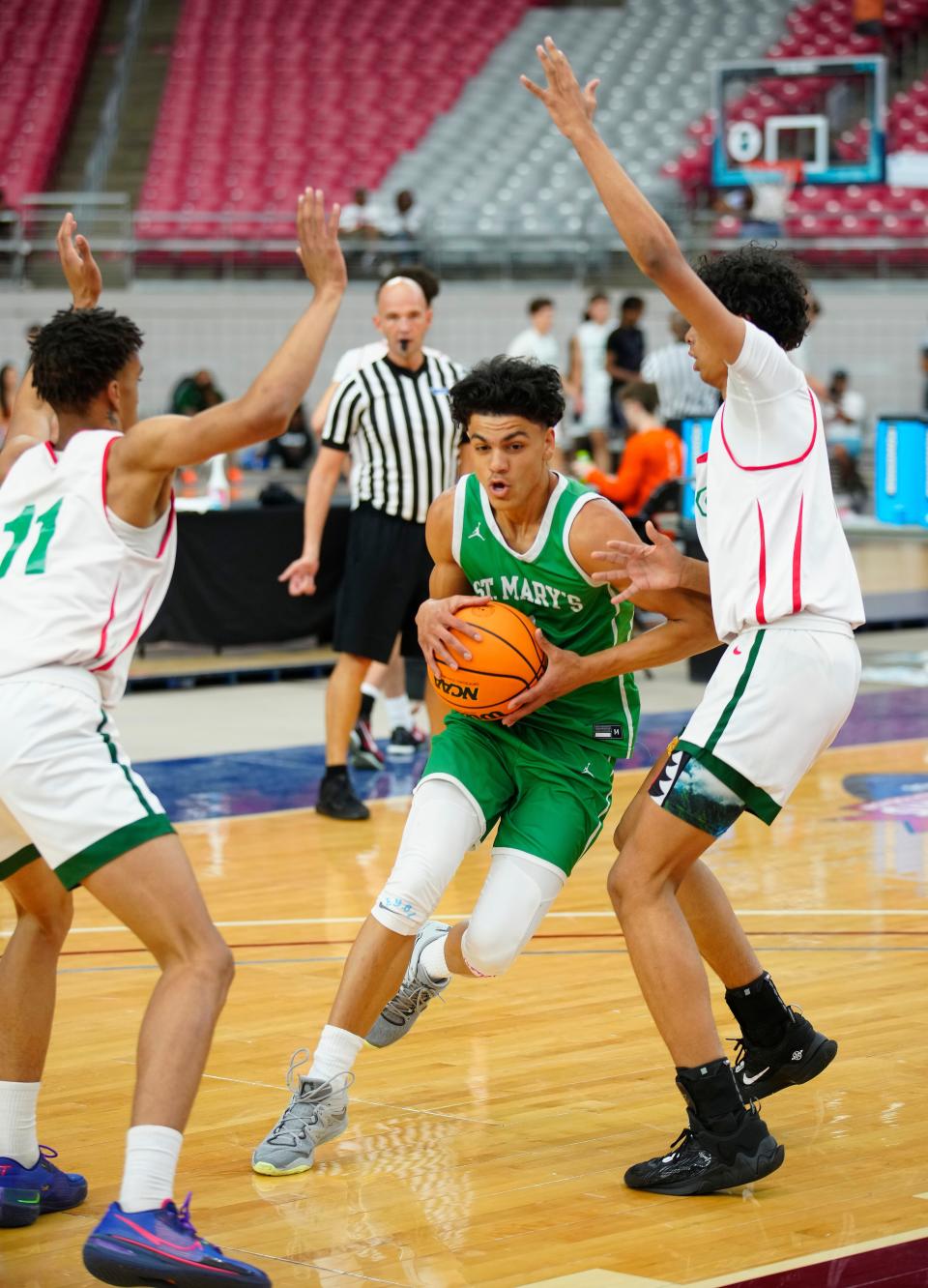 St. Mary’s guard Styles Phipps (1) drives the lane against Smoky Hill during the Section 7 Basketball Tournament at State Farm Stadium in Glendale on June 23, 2023.