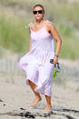 <p>Scarlett Johansson looked chic in white while taking a stroll on the beach in The Hamptons.</p>