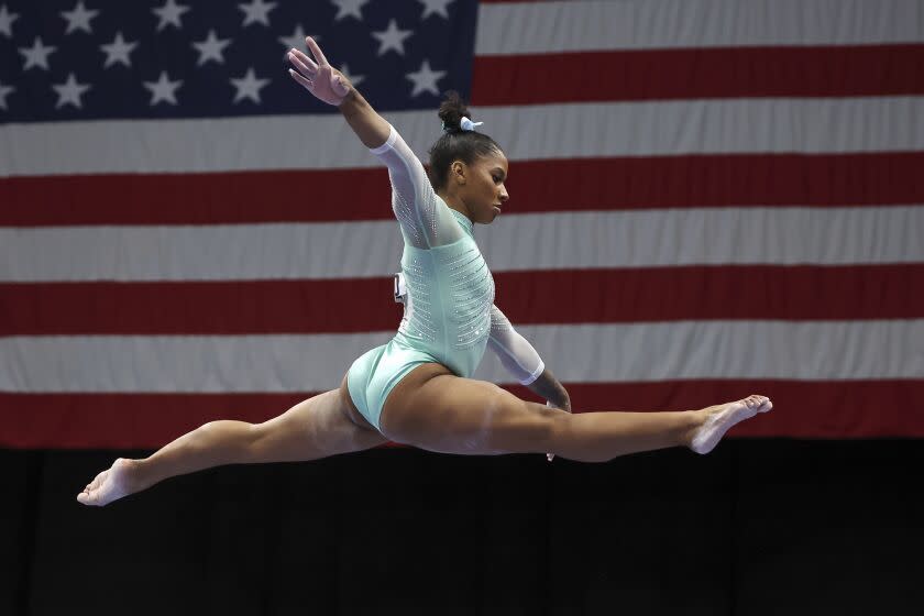 Jordan Chiles competes on the beam during the U.S. Gymnastics Championships Friday, Aug. 19, 2022, in Tampa, Fla.(AP Photo/Mike Carlson)