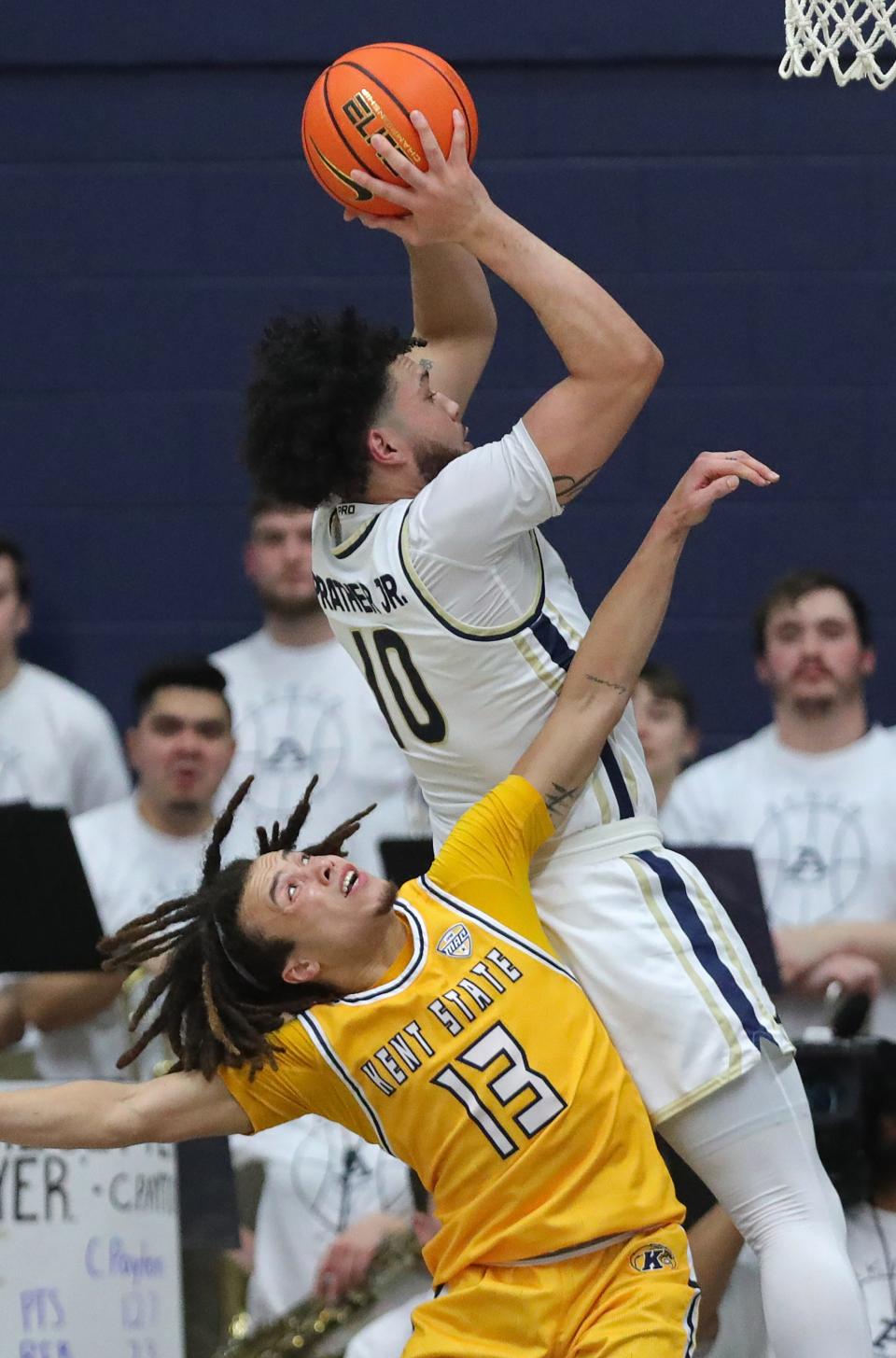 Akron guard Ryan Prather Jr. (10) brings down a rebound over Kent State guard Jalen Sullinger (13) during the second half Friday in Akron.