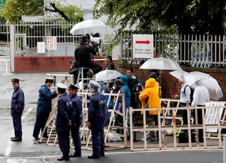 Journalists and policemen stand in front of Tokyo Detention Center where former leader of Aum, the Japanese doomsday cult, Chizuo Matsumoto, who went by the name Shoko Asahara, was executed, in Tokyo, Japan July 6, 2018. REUTERS/Kim Kyung-Hoon