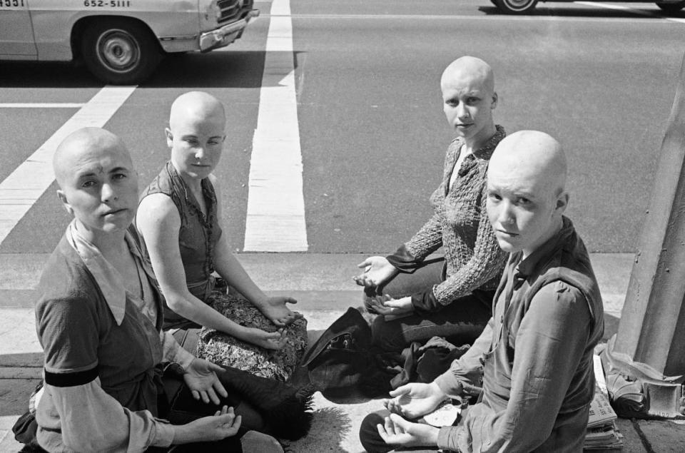 <div class="inline-image__caption"><p>Four young women members of the Charles Manson "family" kneel on the sidewalk outside the Los Angeles at Hall of Justice, March 29, 1971.</p></div> <div class="inline-image__credit">Wally Fong/AP</div>