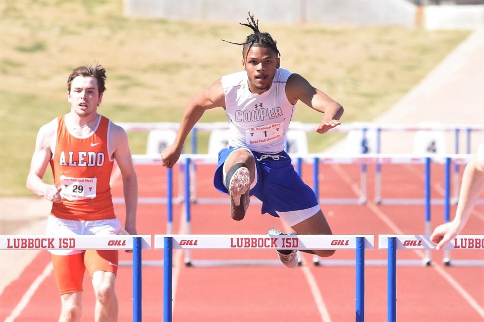 Cooper's Lawrence Diles clears the final hurdle of the boys 300-meter hurdle during the Region I-5A meet last year at PlainsCapital Park in Lubbock.