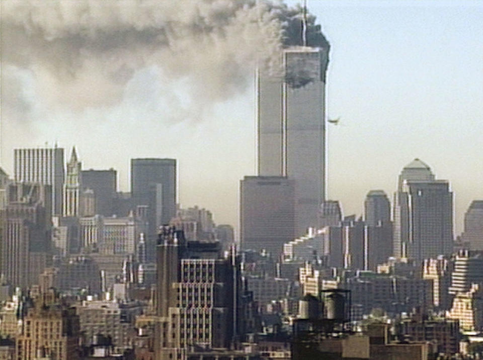 the world towers with smoke coming out the top