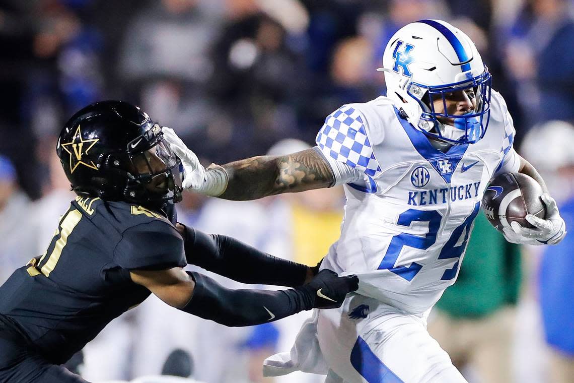 Kentucky star running back Christopher Rodriguez (24) ran the ball past Vanderbilt safety Justin Harris (11) during UK’s 34-17 win over the Commodores last season in Nashville. In his Kentucky career, Rodriguez has run for 392 yards and five touchdowns against Vandy.