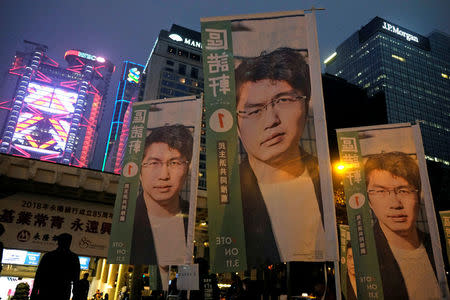 Banners showing portraits of pro-democracy candidate Au Nok-hin are displayed during an election campaign at the financial Central district in Hong Kong, China March 3, 2018. Picture taken March 3, 2018. REUTERS/Bobby Yip