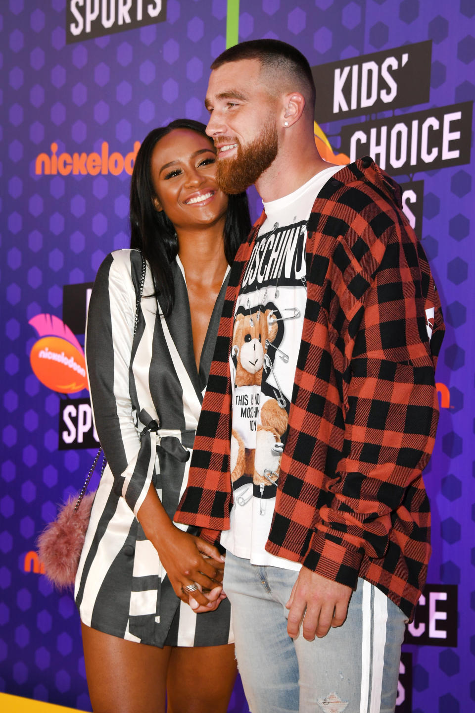 TV personality Kayla Nicole (L) and NFL player Travis Kelce 