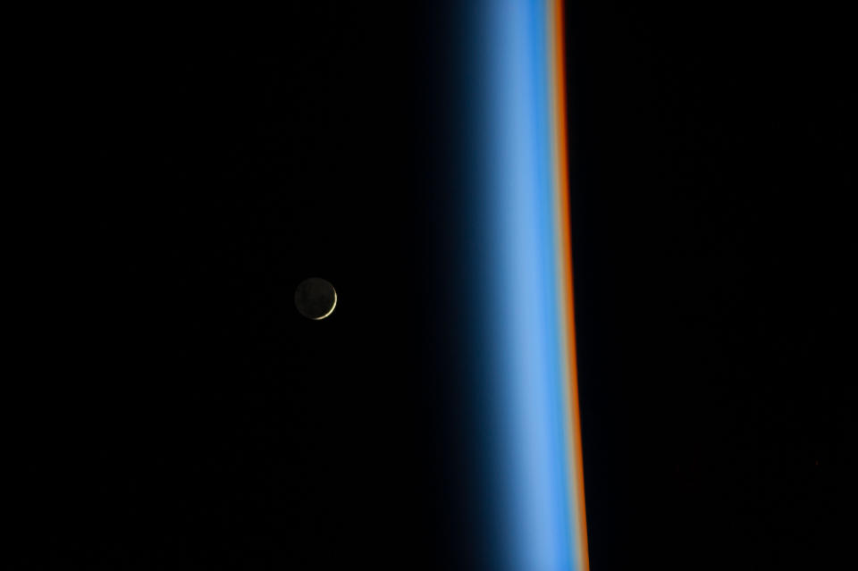 Astronaut Koichi Wakata tweeted this view of a <a href="http://www.nasa.gov/content/crescent-moon-rising-and-earths-atmosphere/#.VI8PKSfwNBJ" target="_blank">crescent moon rising and the cusp of Earth's atmosphere</a> on Feb. 1, 2014.