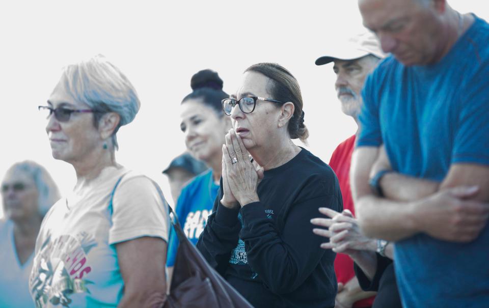 Nancy Arkin, center, attends the one year anniversary of Hurricane Ian at the Lighthouse Park on Sanibel on Thursday, Sept. 28, 2023.
