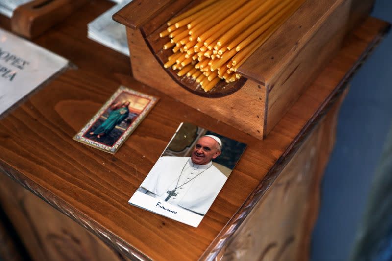 A card depicting Pope Francis is seen inside the Catholic Church of the Assumption of Virgin Mary on the island of Lesbos