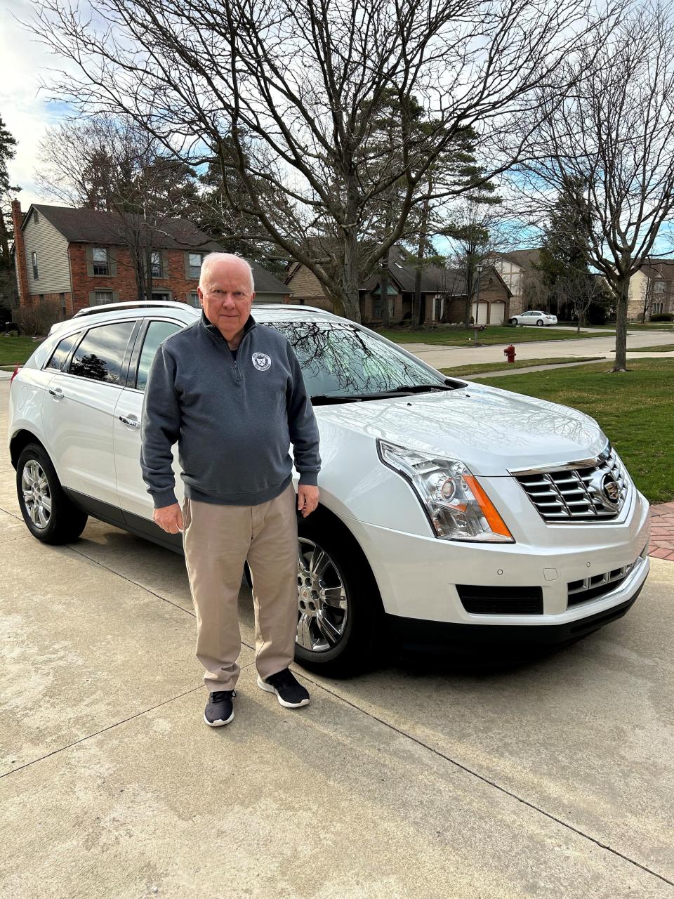 Will Lindley of Livonia was considering trading in his wife's 2016 Cadillac SRX (pictured here) for an electric vehicle, but he said it won't be a General Motors EV if it does not have Apple CarPlay.