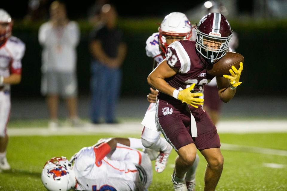 First Baptist Academy's Preston Shemansky (33) runs the ball during the Class 2A-Region 3 football Championship between FBA and Northside Christian on Friday, Nov. 26, 2021 at First Baptist Academy in Naples, Fla. 