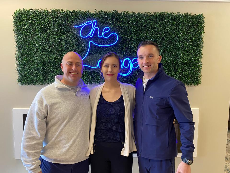 Owners of Live Well IV Hydration Lounge, Inc. Christopher Hamilton, Eryn Iafrate, and Joseph Matrisciano lead a tour of their Raynham business on March 21.