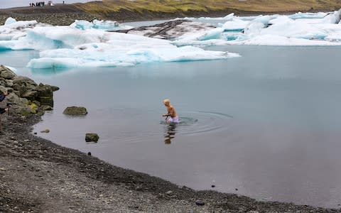 Bieber bathes in an icy lake for his music video - Credit: Getty