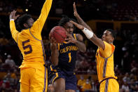 California guard Joel Brown (1) passes as Arizona State guard Jay Heath (5) defends during the first half of an NCAA college basketball game, Thursday, March 3, 2022, in Tempe, Ariz. (AP Photo/Matt York)