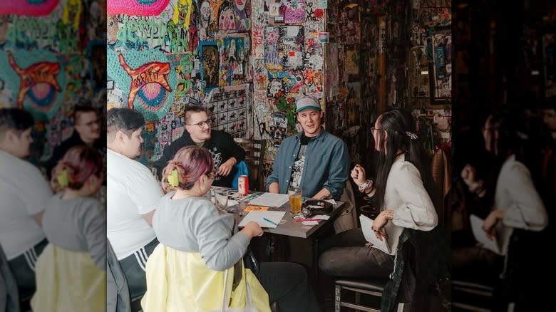 sitting at Tattooed Mom's table