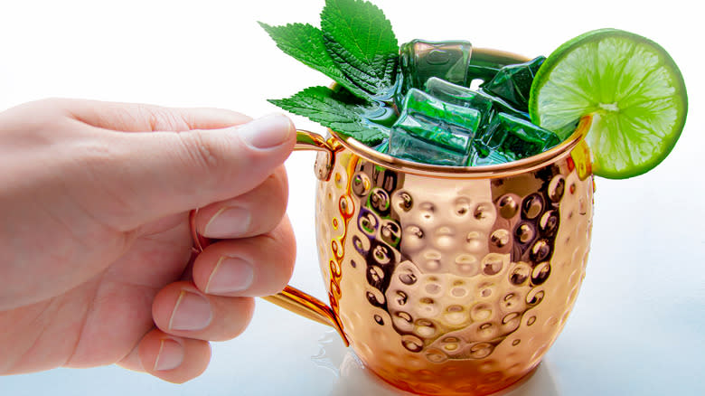 Hand holding Moscow Mule