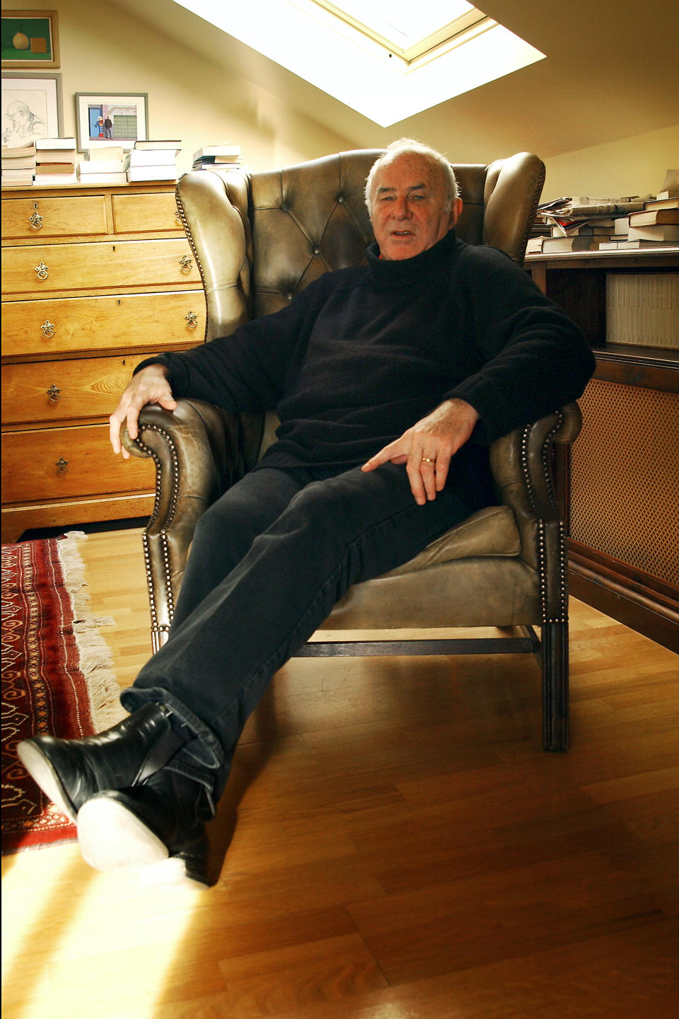 File photo dated 19/02/02 of Clive James at his home in Bermondsey, London. Poet, critic and broadcaster Clive James has died at the age of 80, his agents have said.