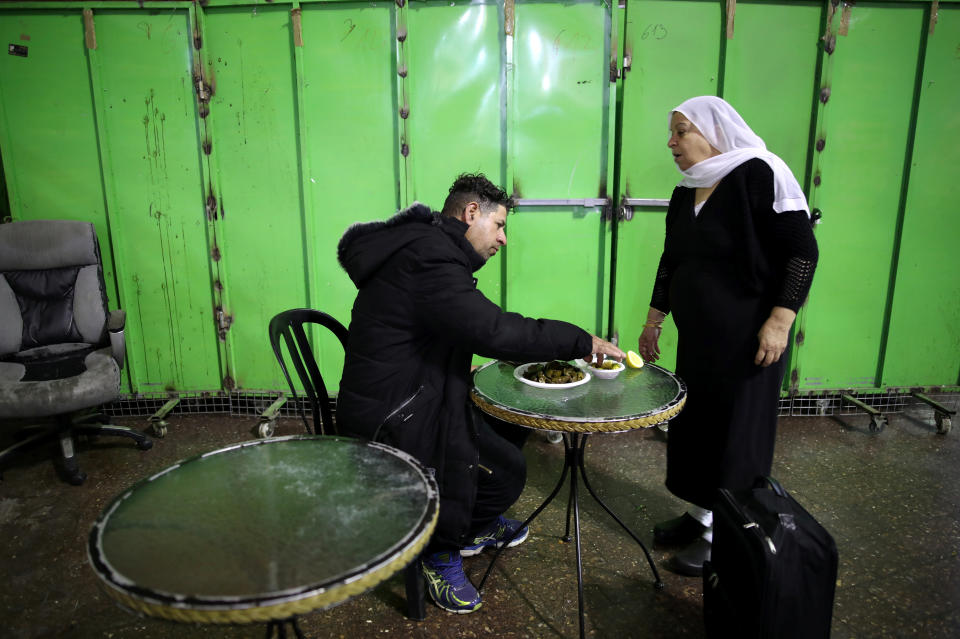 A Druze woman sells traditional food at a makeshift stall at the Central Bus Station on Feb. 3. (Photo: Corinna Kern/Reuters)