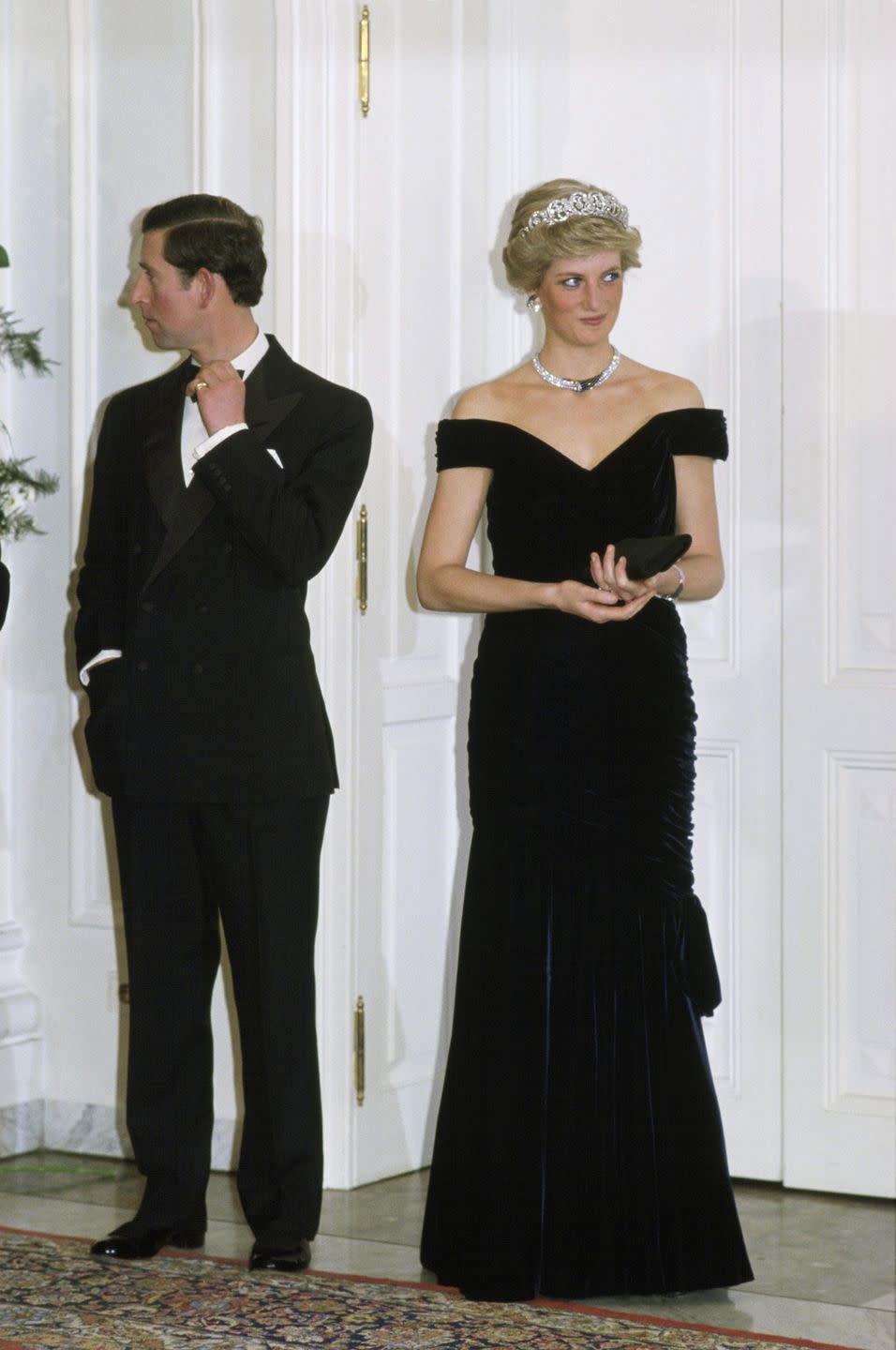 <p>Princess Diana's velvet dress by Victor Edelstein is one of her more iconic ensembles. The Princess wore this dress during a visit to the White House in 1985, where she famously danced with John Travolta. Diana re-wore it two years later on a state visit in Germany, as seen here. </p>