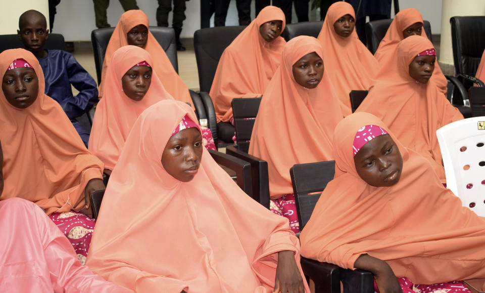The freed students of the LEA Primary and Secondary School Kuriga upon their arrival at the state government house in Kaduna, Nigeria, Monday, March 25, 2024. More than 130 Nigerian schoolchildren rescued after more than two weeks in captivity have arrived in their home state in northwestern Nigeria ahead of their anticipated reunions with families. (AP Photo/Habila Darofai)