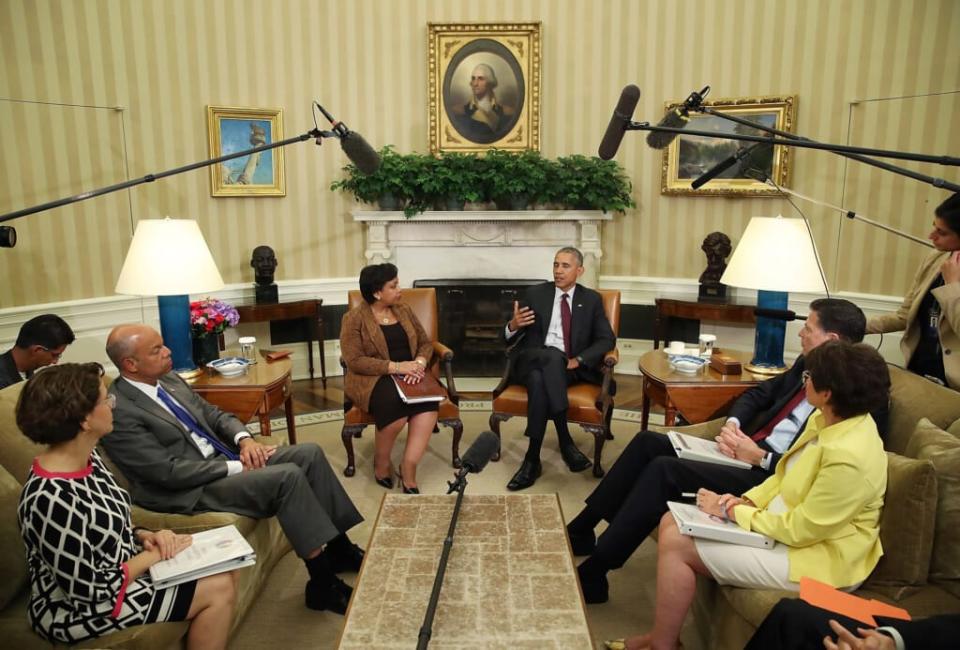 U.S. President Barack Obama (C) speaks to the media as (L-R) White House Domestic Policy Council Cecilia Munoz, Homeland Security Secretary Jeh Johnson, Attorney General Loretta Lynch, FBI Director James Comey and senior advisor Valerie Jarrett listen in the Oval Office at the White House July 19, 2016 in Washington, DC. (Photo by Mark Wilson/Getty Images)