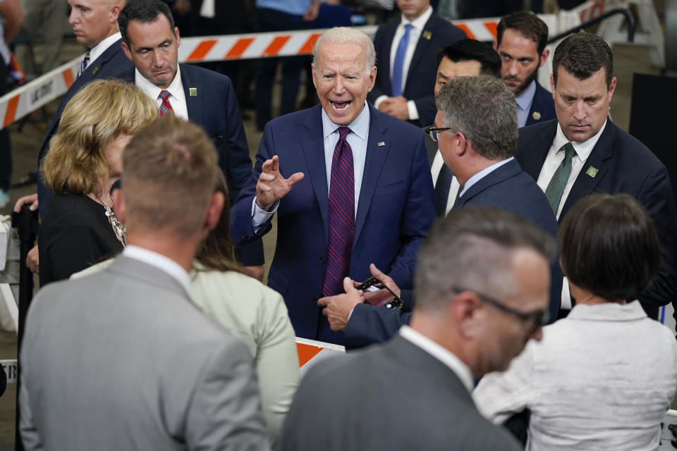 President Joe Biden talks with guests after speaking about infrastructure spending at the La Crosse Municipal Transit Authority, Tuesday, June 29, 2021, in La Crosse, Wis. (AP Photo/Evan Vucci)