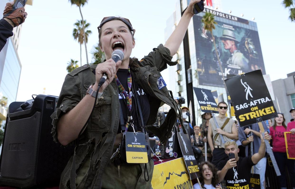 SAG-AFTRA captain Mary M. Flynn rallies fellow striking actors on a picket line outside Netflix studios in November 2023. <a href="https://newsroom.ap.org/detail/APTOPIXHollywoodStrikes/5dfb21d54c2f4414bd9f4adde9a2a0e1/photo?Query=hollywood%20strike&mediaType=photo&sortBy=arrivaldatetime:desc&dateRange=Anytime&totalCount=2120&currentItemNo=33" rel="nofollow noopener" target="_blank" data-ylk="slk:AP Photo/Chris Pizzello;elm:context_link;itc:0;sec:content-canvas" class="link ">AP Photo/Chris Pizzello</a>