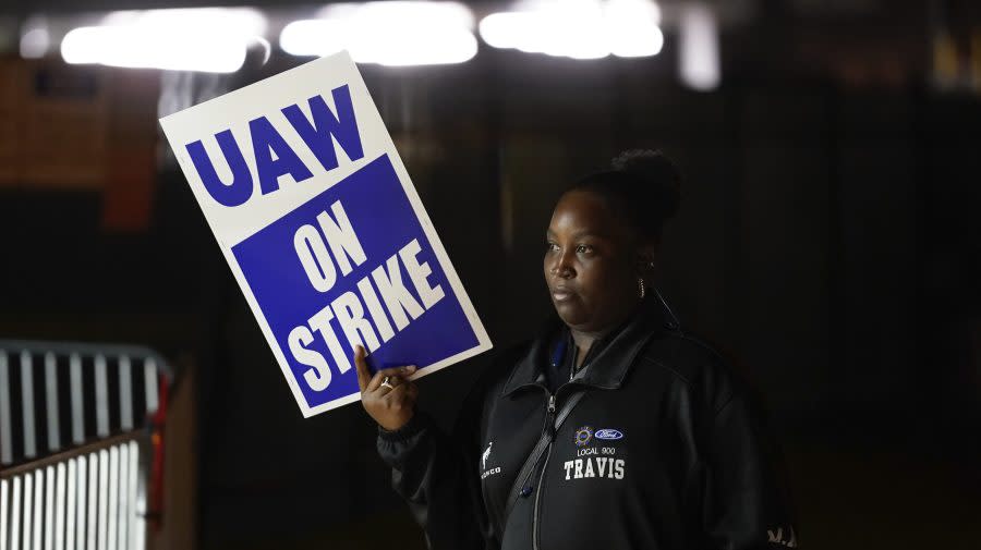 A United Auto Workers member strikes at the Ford Motor Company Michigan Assembly Plant in Wayne, Mich., Friday, Sept. 15, 2023. (AP Photo/Paul Sancya)