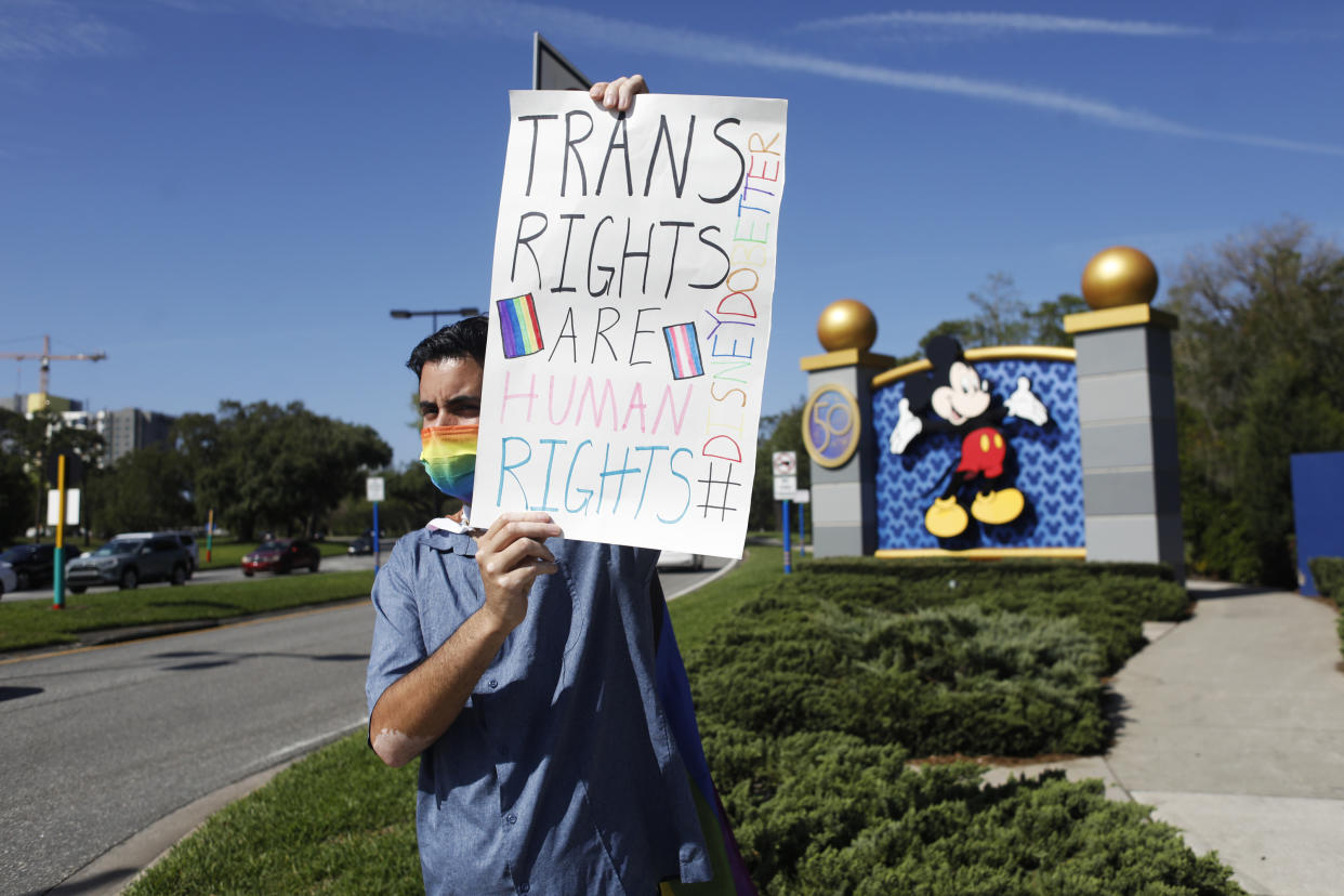 ORLANDO, FL - MARCH 22: Disney employee Nicholas Maldonado holds a sign while protesting outside of Walt Disney World on March 22, 2022 in Orlando, Florida. Employees are staging a company-wide walkout today to protest Walt Disney Co.'s response to controversial legislation passed in Florida known as the “Don’t Say Gay” bill. (Photo by Octavio Jones/Getty Images)