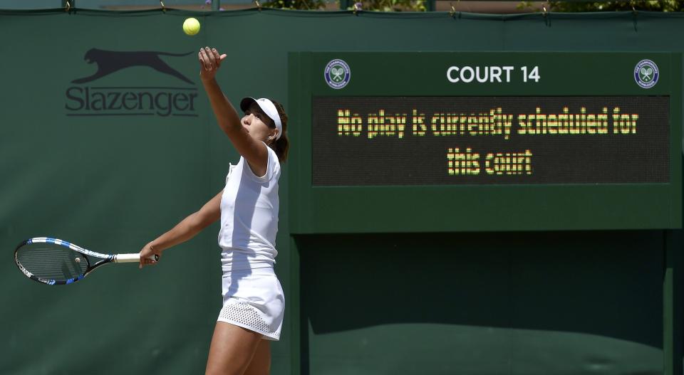 Garbine Muguruza of Spain serves during a practice session at the Wimbledon Tennis Championships in London, July 10, 2015. REUTERS/Toby Melville