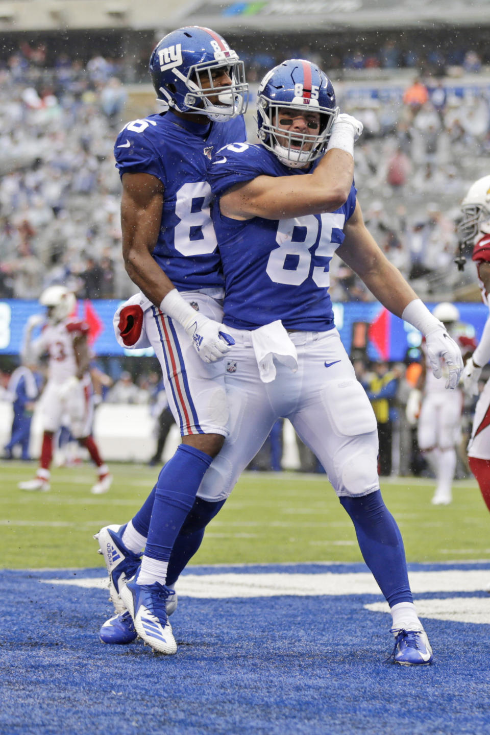 New York Giants' Rhett Ellison, right, celebrates his touchdown with Darius Slayton during the first half of an NFL football game against the Arizona Cardinals, Sunday, Oct. 20, 2019, in East Rutherford, N.J. (AP Photo/Adam Hunger)