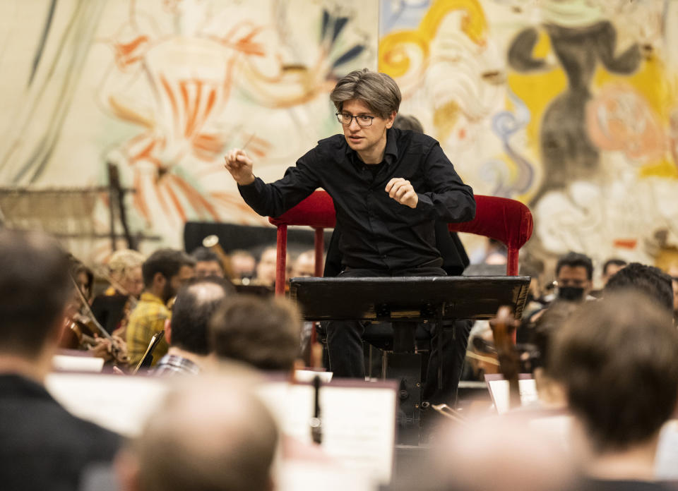 This image released by the Metropolitan Opera shows Daniele Rustioni conducting the Metropolitan Opera Orchestra during a rehearsal on Feb. 9, 2023 in New York. (Jonathan Tichler/Metropolitan Opera via AP)