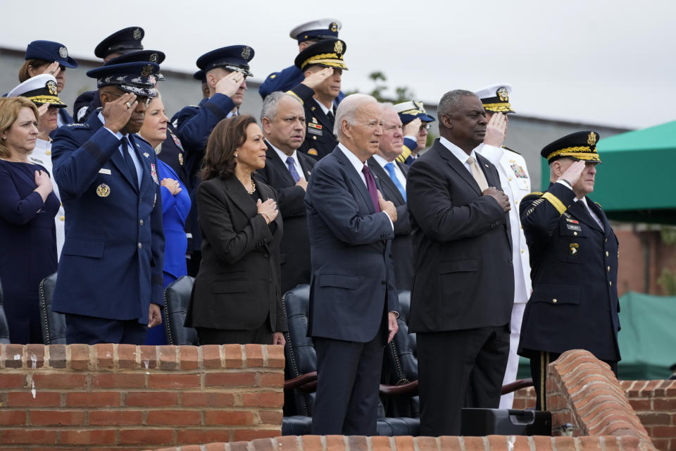Front row from left, Gen. CQ Brown, Jr., Vice President Kamala Harris, President Joe Biden, Defense Secretary Lloyd Austin and retiring Chairman of the Joint Chiefs of Staff Gen. Mark Milley stand during the playing of the national anthem during the Armed Forces Farewell Tribute in honor Milley and hail for Brown, the incoming chairman, at Joint Base Myer-Henderson Hall, Friday, Sept. 29, 2023, in Fort Meyer, Va. (AP Photo/Manuel Balce Ceneta)