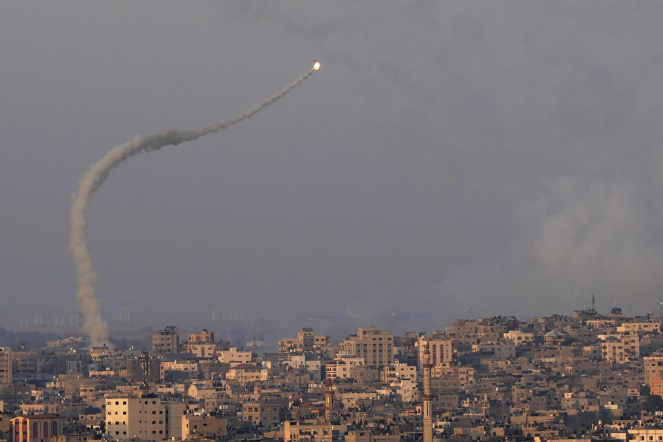 Rockets are launched from Gaza towards Israel, over Gaza City, Sunday, Aug. 7, 2022. Israel said Sunday it killed a senior Islamic Jihad commander in a crowded Gaza refugee camp, the second such targeted attack since launching its high-stakes military offensive against the militant group just before the weekend. The Iran-backed militant group has fired hundreds of rockets at Israel in response, raising the risk of the cross-border fighting turning into a full-fledged war. (AP Photo/Adel Hana)