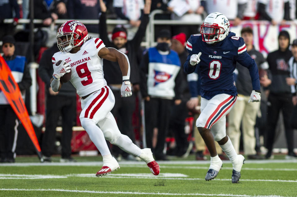 Louisiana-Lafayette running back Emani Bailey (9) runs the ball against Liberty during an NCAA college football game, Saturday, Nov. 20, 2021, at Williams Stadium in Lynchburg, Va. (AP Photo/Kendall Warner)