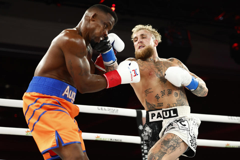 ORLANDO, FLORIDA - DECEMBER 15: Jake Paul punches Andre August during the Jake Paul v Andre August at Caribe Royale Orlando on December 15, 2023 in Orlando, Florida. (Photo by Douglas P. DeFelice/Getty Images for CELSIUS)