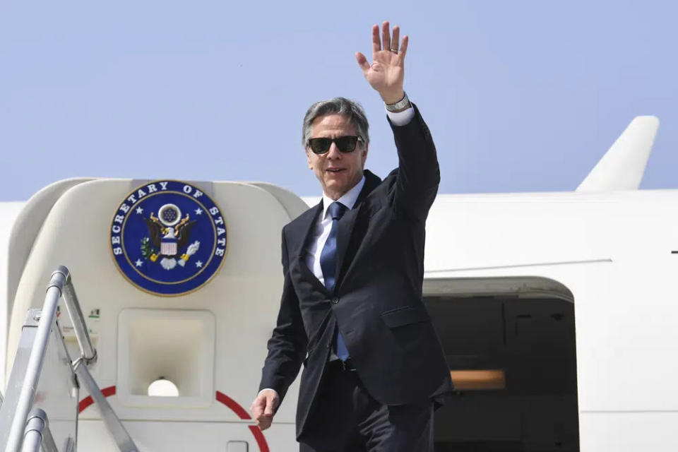 U.S. Secretary of State Antony Blinken waves as he boards his plane at New Delhi Airport to depart for Washington, D.C. from New Delhi, India, Friday, March 3, 2023. (Olivier Douliery/Pool Photo via AP)