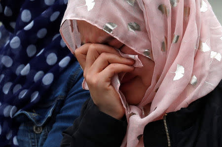 People gather to pay respects after Friday's shooting, outside the Masjid Al Noor in Christchurch, New Zealand March 18, 2019. REUTERS/Jorge Silva