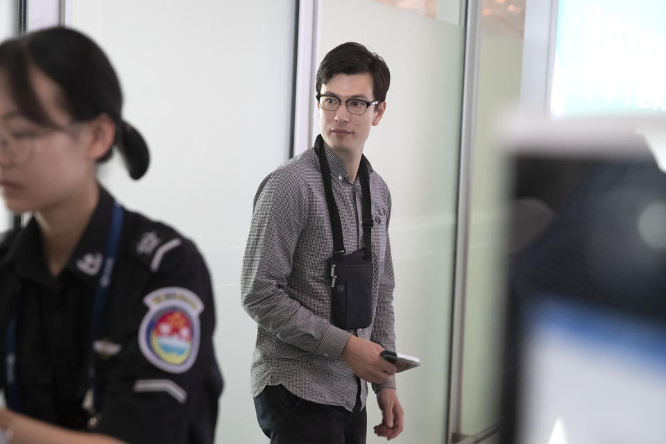 Australian student Alek Sigley arrives at Beijing Capital International Airport in Beijing, Thursday, July 4, 2019. Sigley was released after a week in detention in North Korea described his condition to reporters in Beijing on Thursday as "very good," without saying what happened. (AP Photo/Mark Schiefelbein)