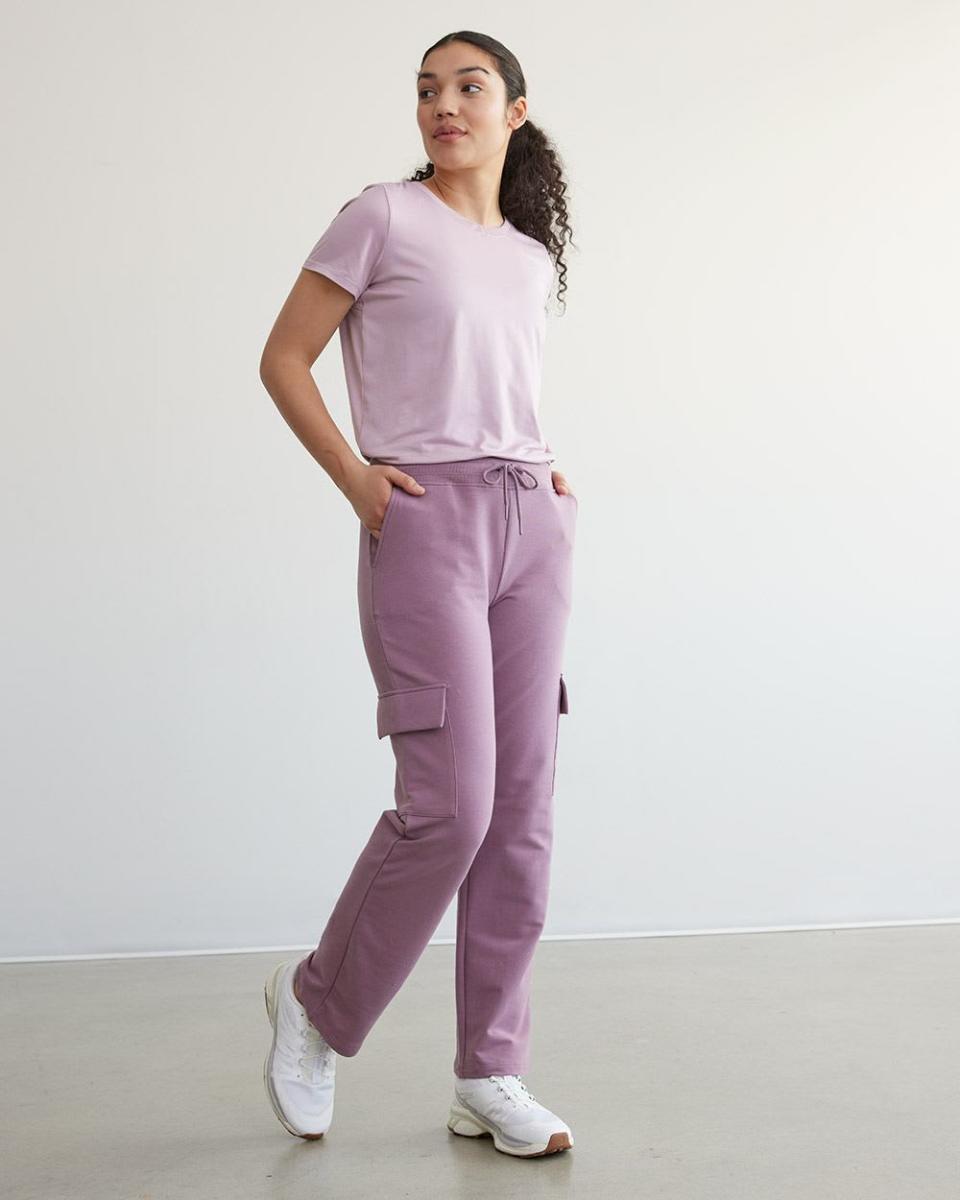 model wears purple Hyba Cargo Pants. 