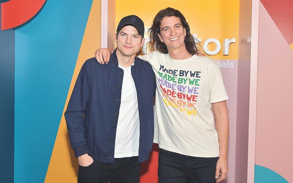 Adam Neumann with Ashton Kutcher at a WeWork ‘festival’ in 2019 - Getty Images