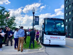  Nearly 60 passengers, many of them emerging real estate developers, took a bus tour of transformed lots that are to be sold by the Omaha Land Bank for housing construction projects. (Cindy Gonzalez/Nebraska Examiner)