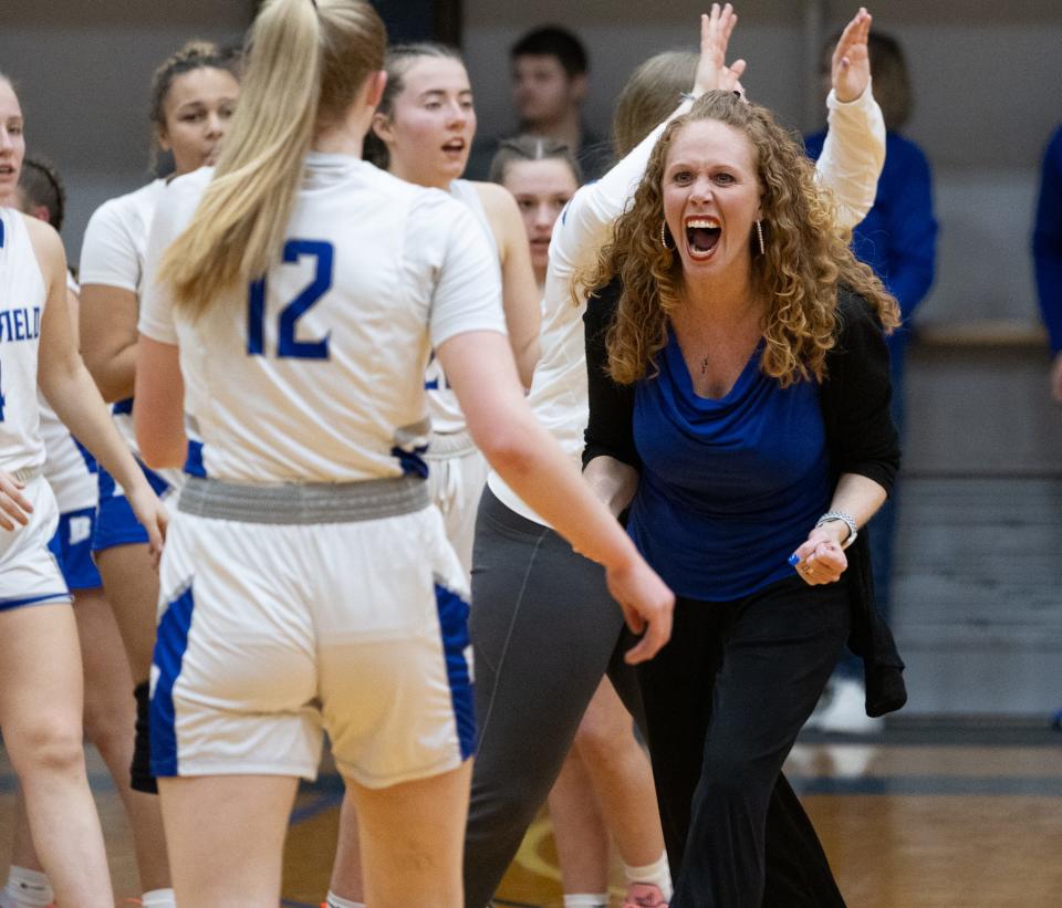 Bloomfield coach Julie Kimball celebrates during a timeout.