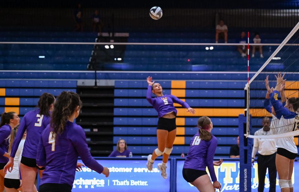 Lexington's Tatum Stover skies toward a ball during Lady Lex's win over Ontario in the first game of the season.