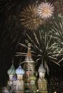 Fireworks explode in the sky during New Year celebrations in Moscow's Red Square January 1, 2014. REUTERS/Tatyana Makeyeva