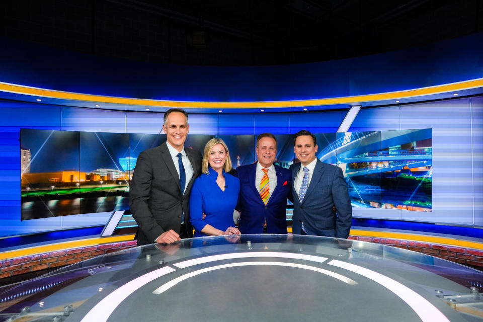 KCCI news anchor Steve Karlin, middle, poses for a photo with sport director Scott Reister (left), his co-anchor Stacey Horst, and chief meteorologist Chris Gloninger after his last new report after 34 years at the station in Des Moines on March 1, 2023.